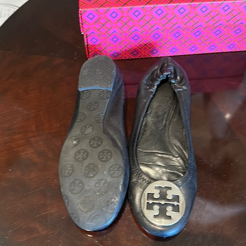 Iconic silver buckle Tory flats.